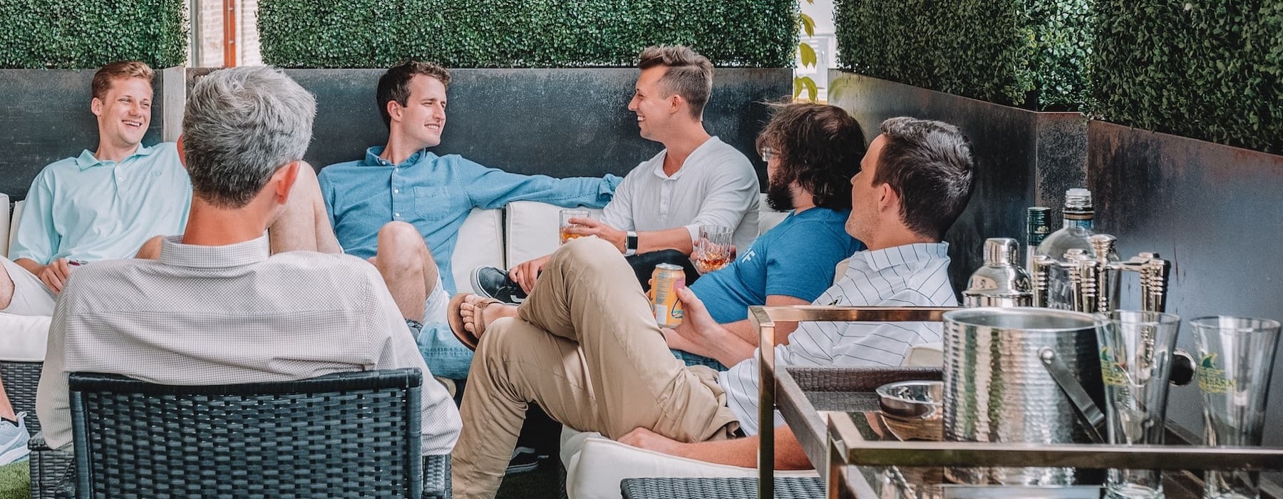 lifestyle image of a group of people laughing and socializing